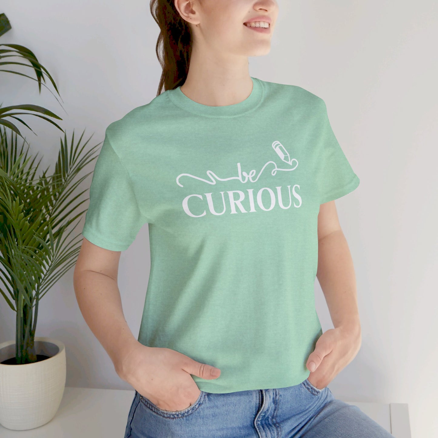 Be Curious with Lighthouse International logo on back Unisex Jersey Short Sleeve Tee