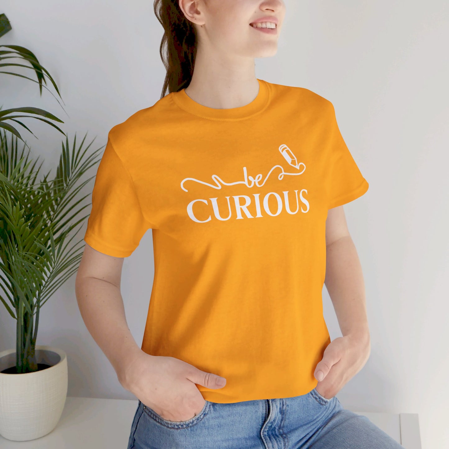 Be Curious with Lighthouse International logo on back Unisex Jersey Short Sleeve Tee