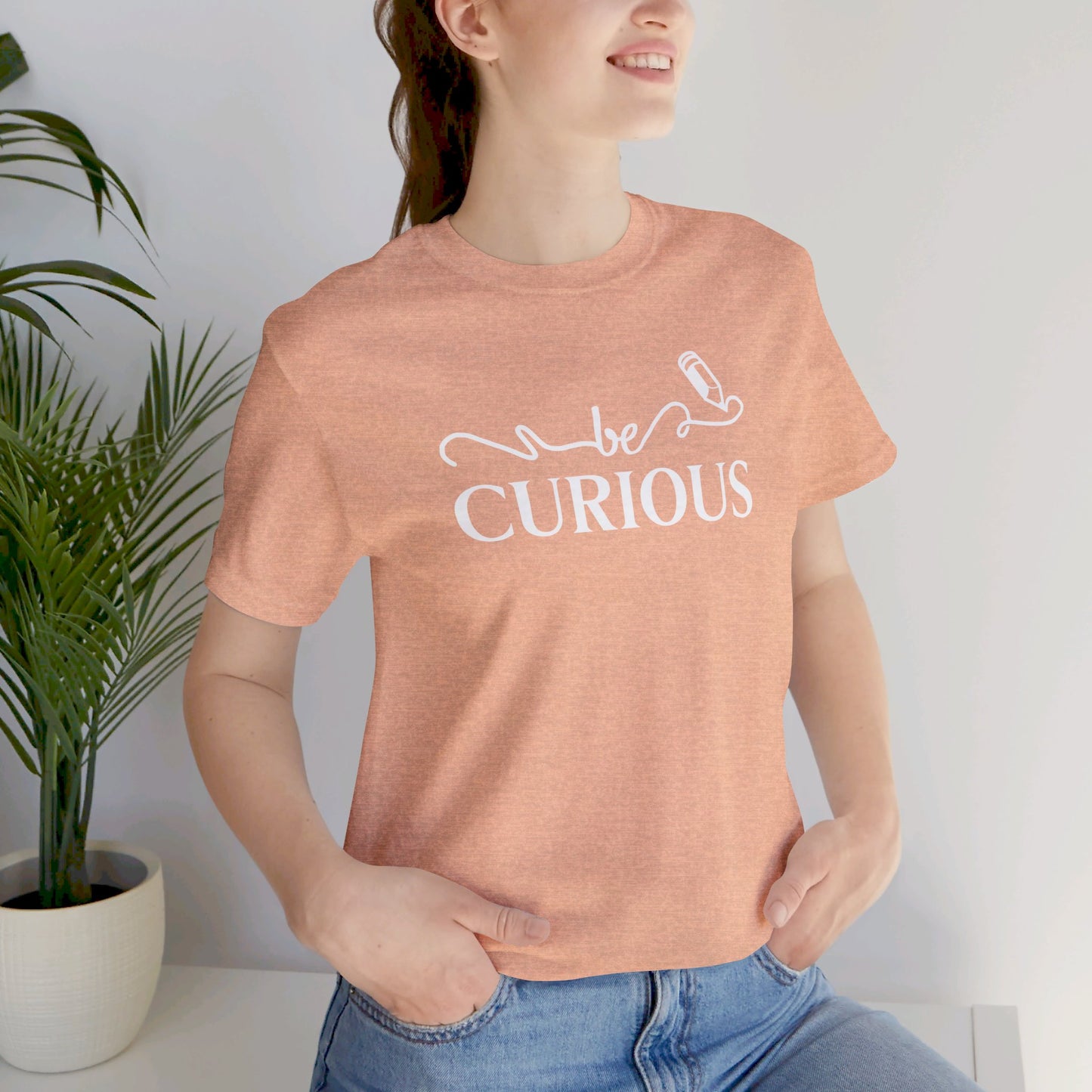 Be Curious with Lighthouse International logo on back Unisex Jersey Short Sleeve Tee