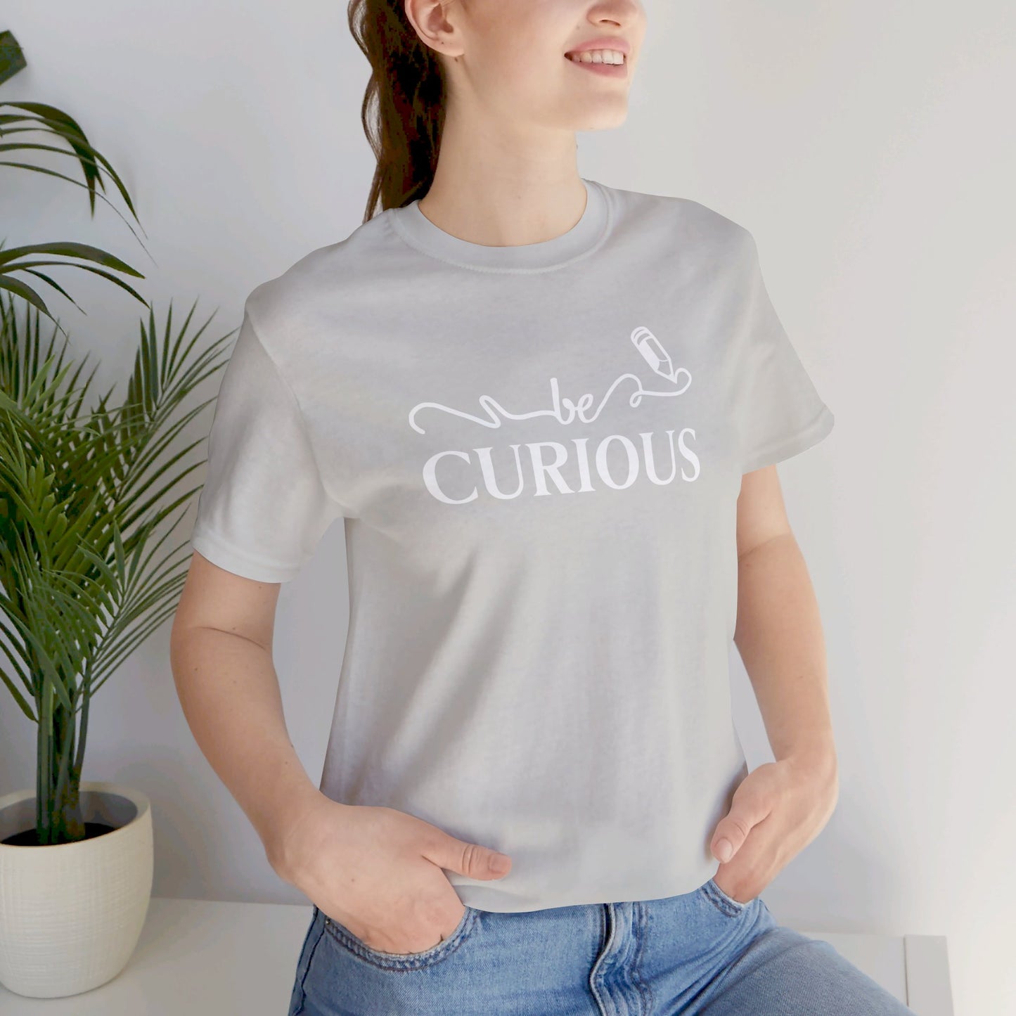 Be Curious with Lighthouse International logo on back Unisex Jersey Short Sleeve Tee