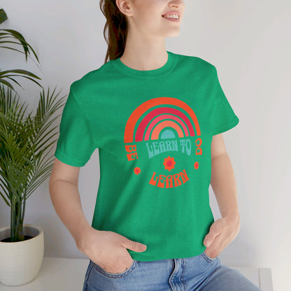 Learn to Be Rainbow Unisex Jersey Short Sleeve Tee